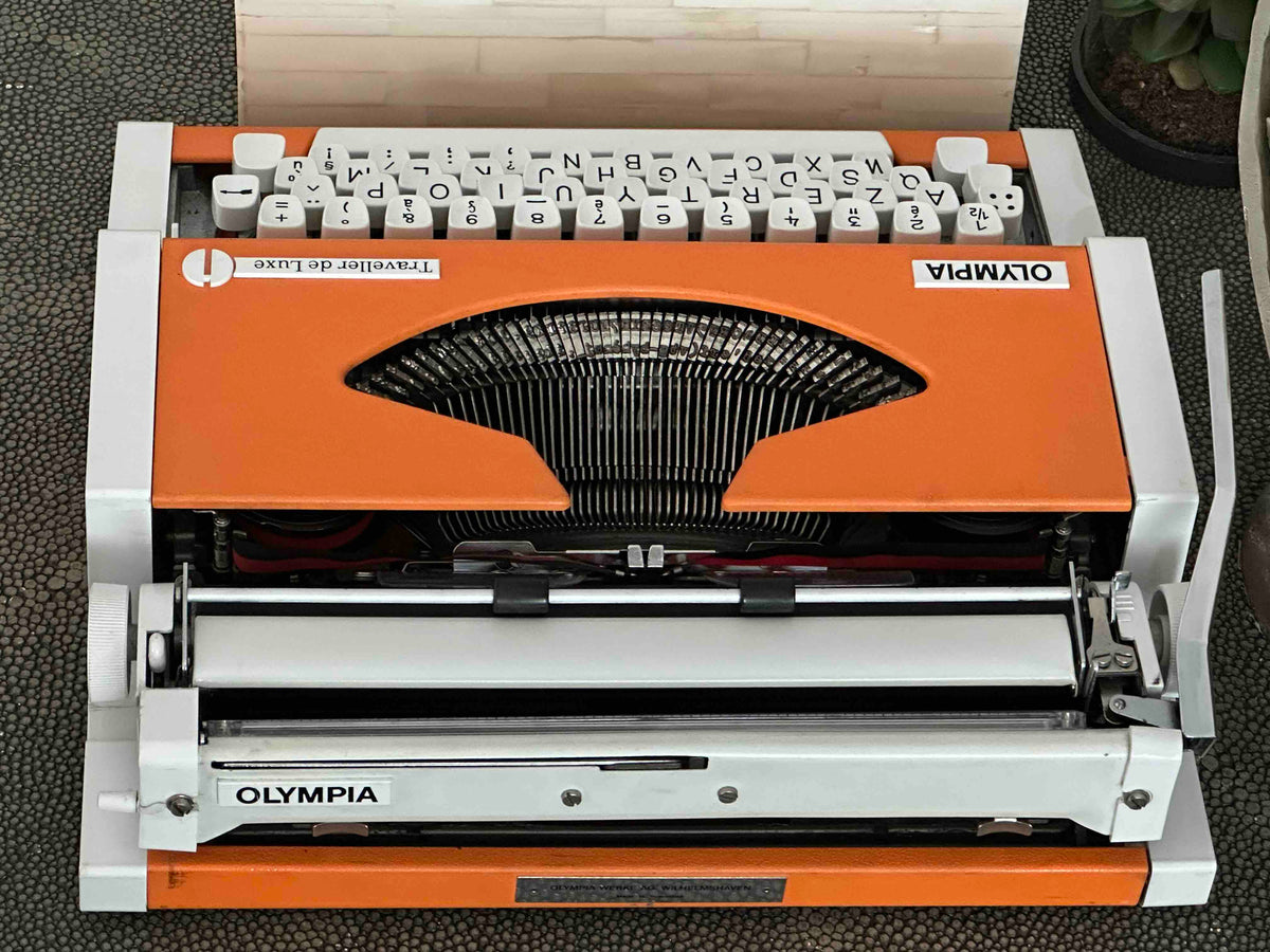 Orange Olympia Traveller de Luxe Typewriter with Azerty Layout, 1977, Fully Working Typewriter