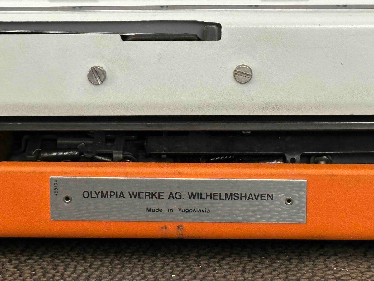 Orange Olympia Traveller de Luxe Typewriter with Azerty Layout, 1977, Fully Working Typewriter