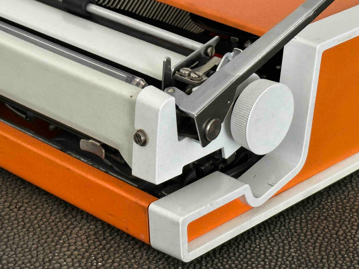Orange Olympia Traveller de Luxe Typewriter with Azerty Layout, 1977, Fully Working Typewriter